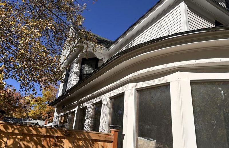 Older home with painted trim and windows