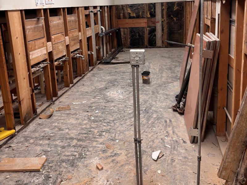 Commercial interior with wall finishes stripped and debris cleared